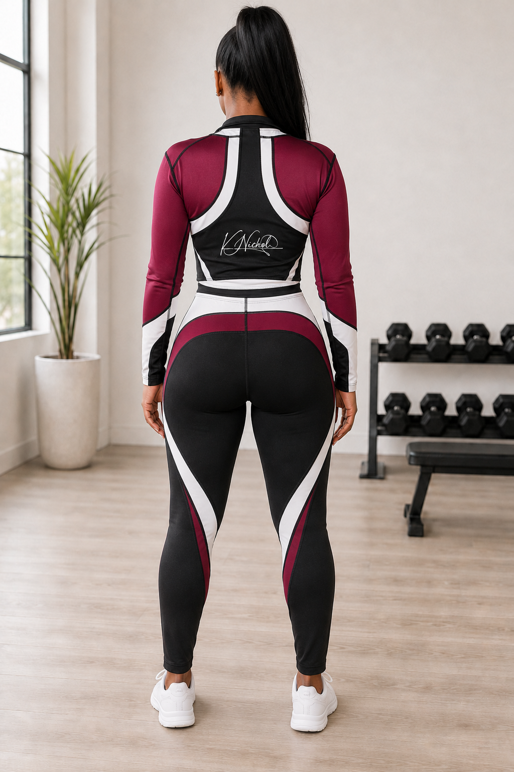 Back view of the burgundy, black, and white K Nichol workout fitness wear set
